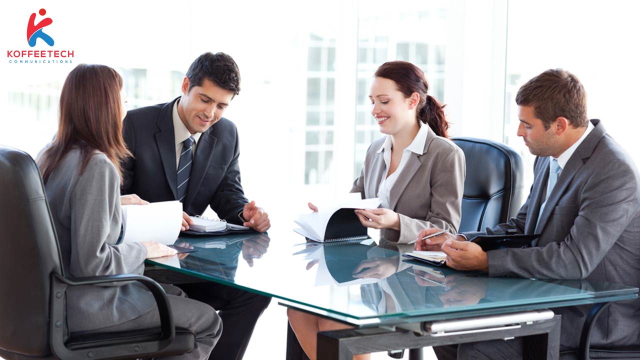 Hiring a marketing team to quickly picture of people around a table in an office environment