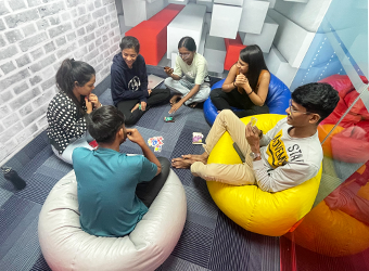 People playing cards and Jenga